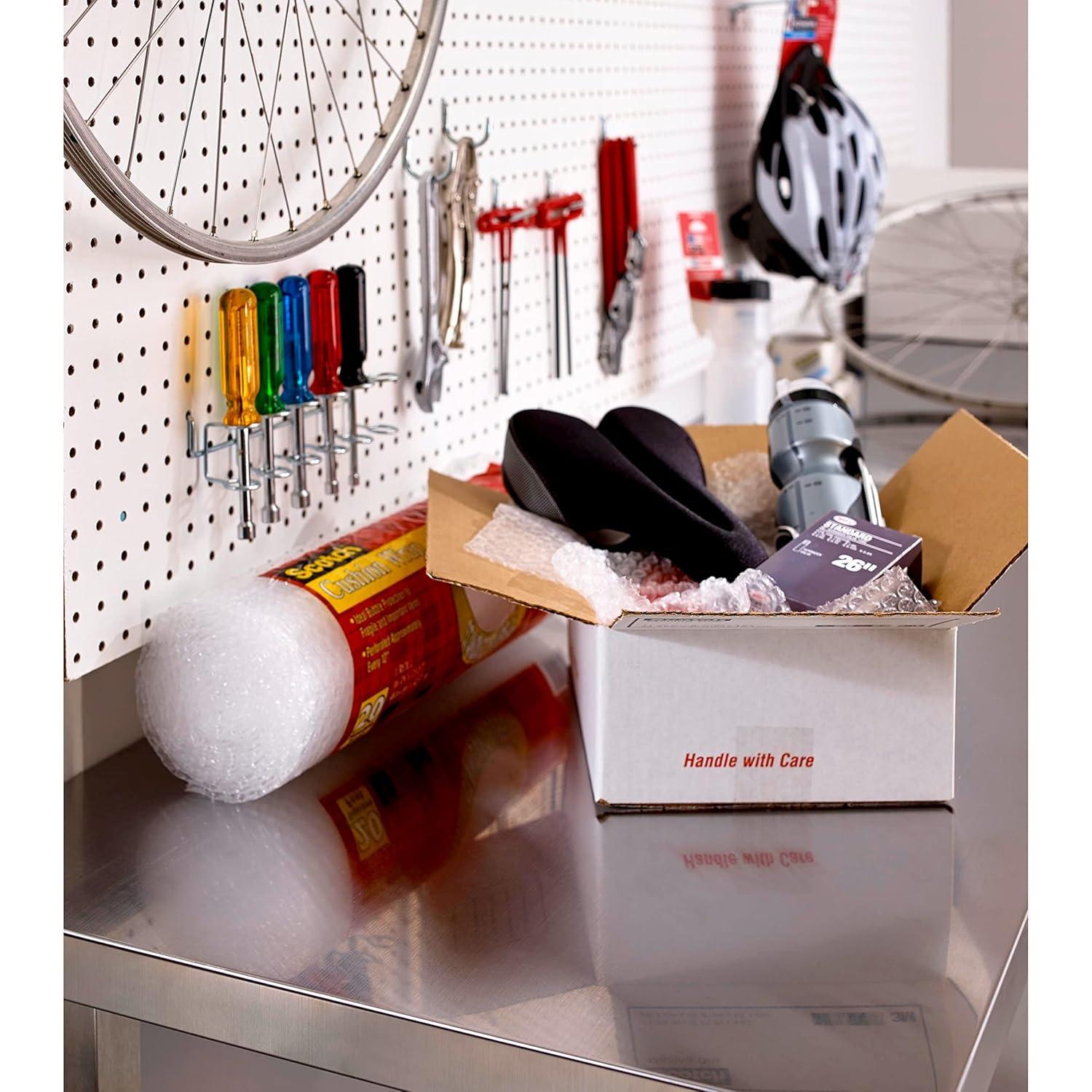 imageScotch Tough Grip Moving Packing Tape Clear Moving Tape That Secures Boxes up to 80 Pounds Holiday Shipping Tape for Large Boxes 188 in x 546 yd 1 Tape Roll1 Roll